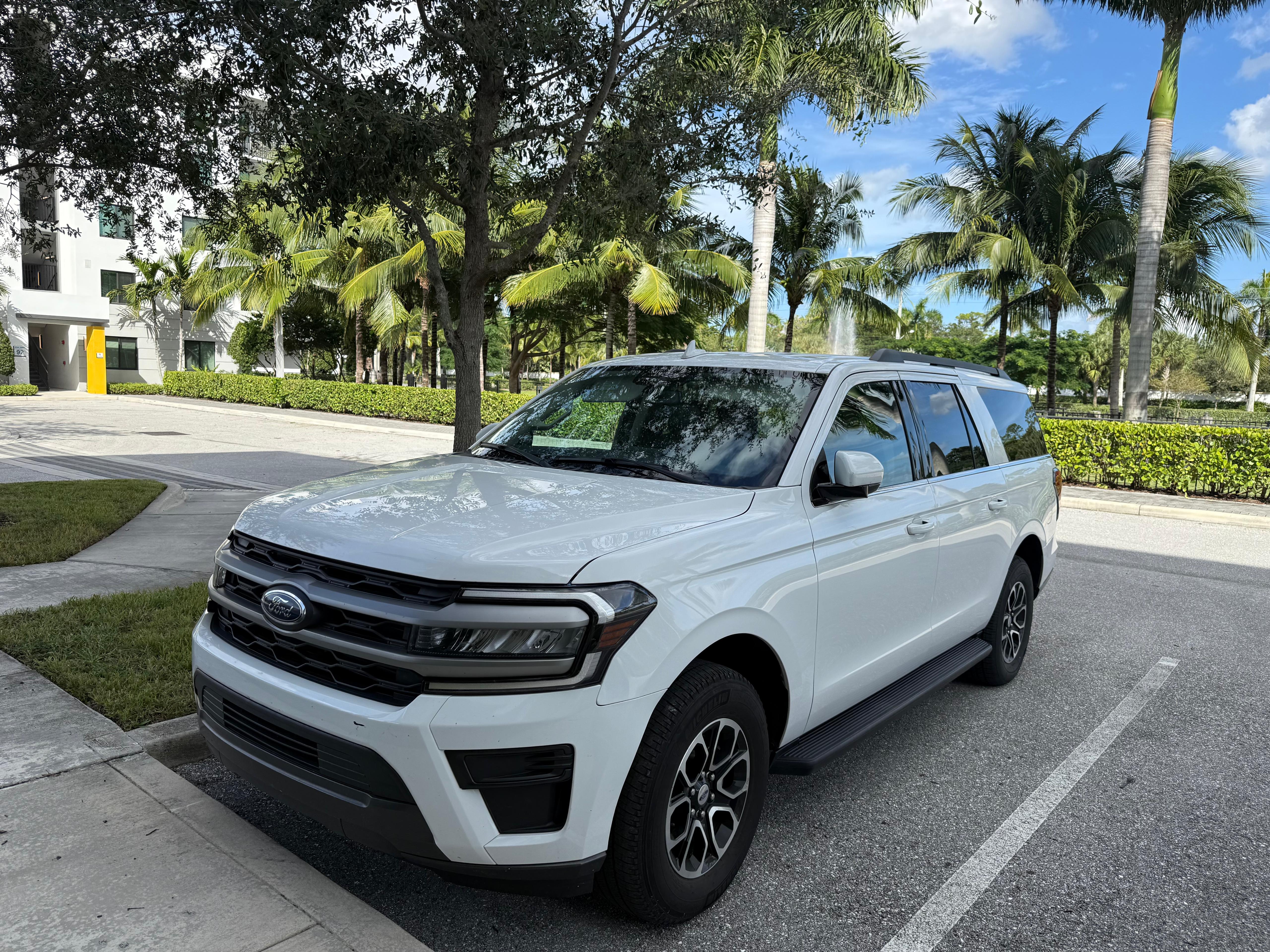 White Ford Expedition cleaned and parked